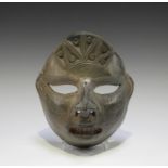 A 20th century Columbian glazed terracotta ethnic mask, 20cm x 19cm.Buyer’s Premium 29.4% (including