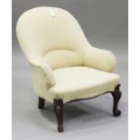 A Victorian mahogany tub back salon armchair, upholstered in cream fabric, on cabriole legs,