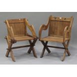 A 20th century Glastonbury style oak armchair, pierced with trefoils, height 94cm, width 62cm,