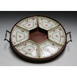 An early 20th century mahogany circular gallery tea tray, fitted with a pair of handles and inset