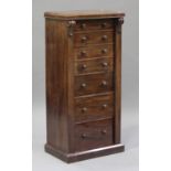 A late Victorian mahogany secrétaire Wellington chest, fitted with six drawers flanked by carved