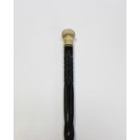 A 19th century ebony and marine ivory mounted Scrimshaw walking cane, the reeded circular handle