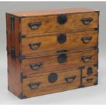 A 20th century Japanese softwood chest of drawers with iron mounts, fitted with an arrangement of