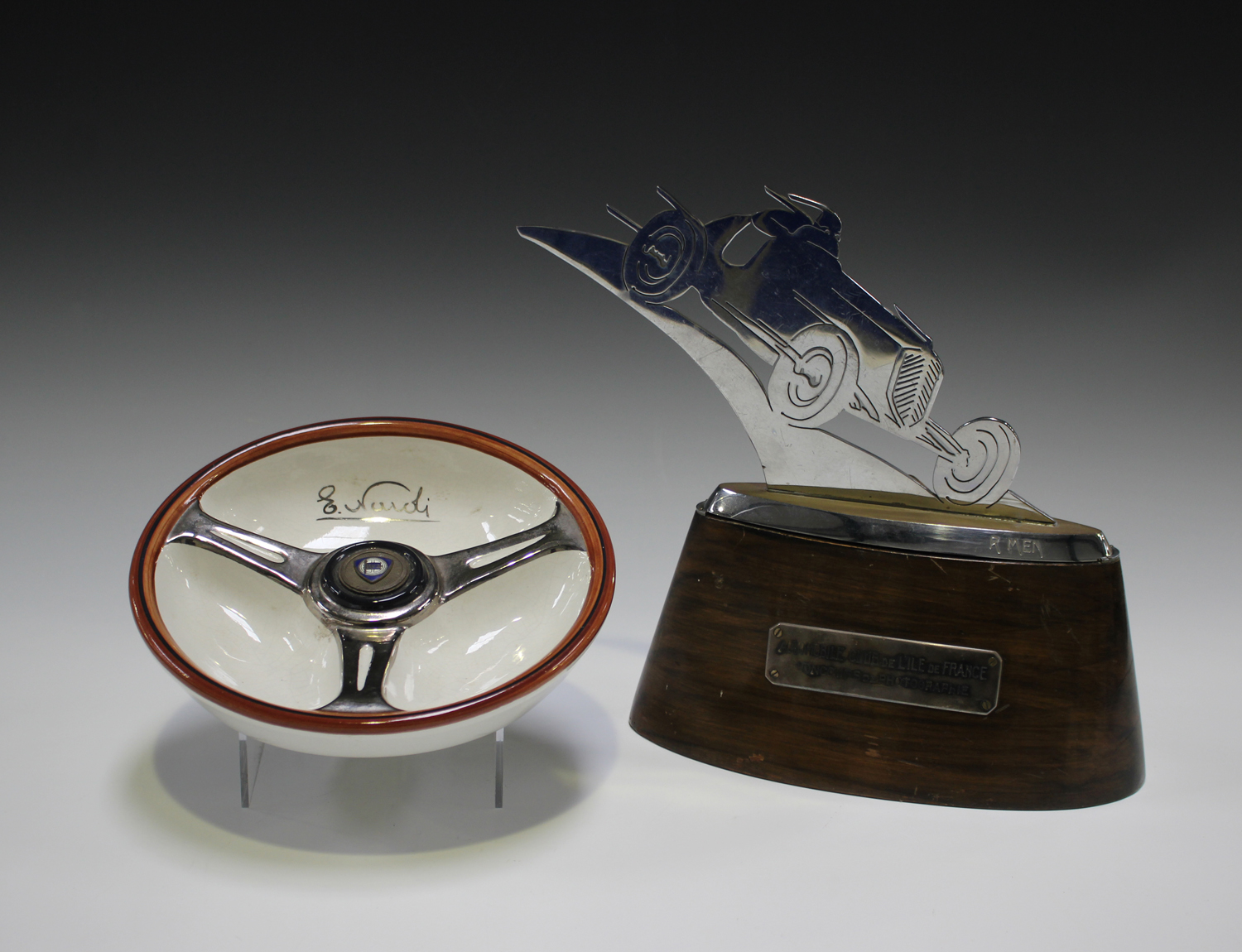 A French chromium plated racing trophy, pierced and cut in the form of an early racing car,