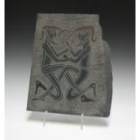 A 20th century slate panel, incised with a pair of Celtic style men, the reverse inscribed '