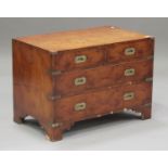 A late 20th century yew campaign style chest of two short and two long drawers, on bracket feet,