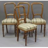 A set of four early 20th century Scandinavian beech dining chairs with overstuffed seats, on