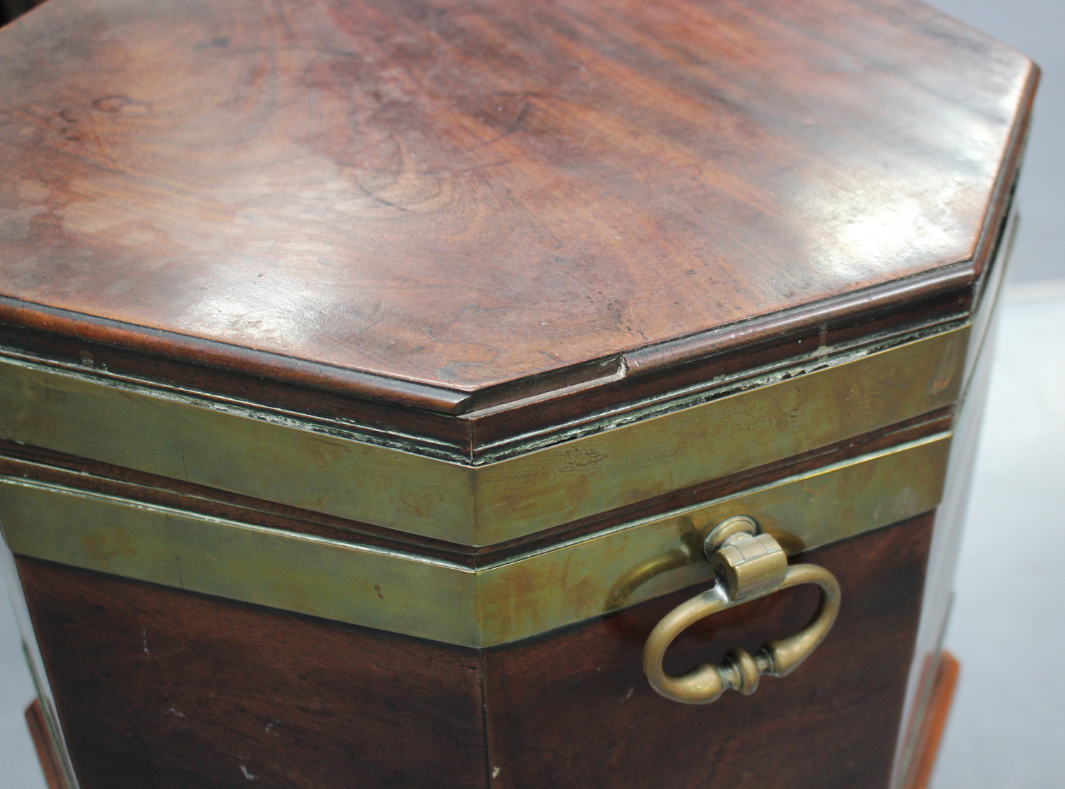 A George III mahogany and brass bound cellaret of octagonal form, the hinged lid enclosing a lead- - Image 2 of 5