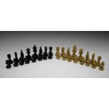 A modern turned and carved wooden chess set with weighted bases, height of king 8.8cm.Buyer’s