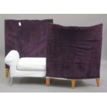A modern conversation settee, the opposing tub backs covered in purple fabric, height 110cm, width