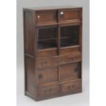A 20th century Japanese elm side cabinet, fitted with an arrangement of drawers and sliding