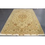 A fine Tabriz carpet, Central Persia, modern, the cream field with a flowerhead medallion, supported