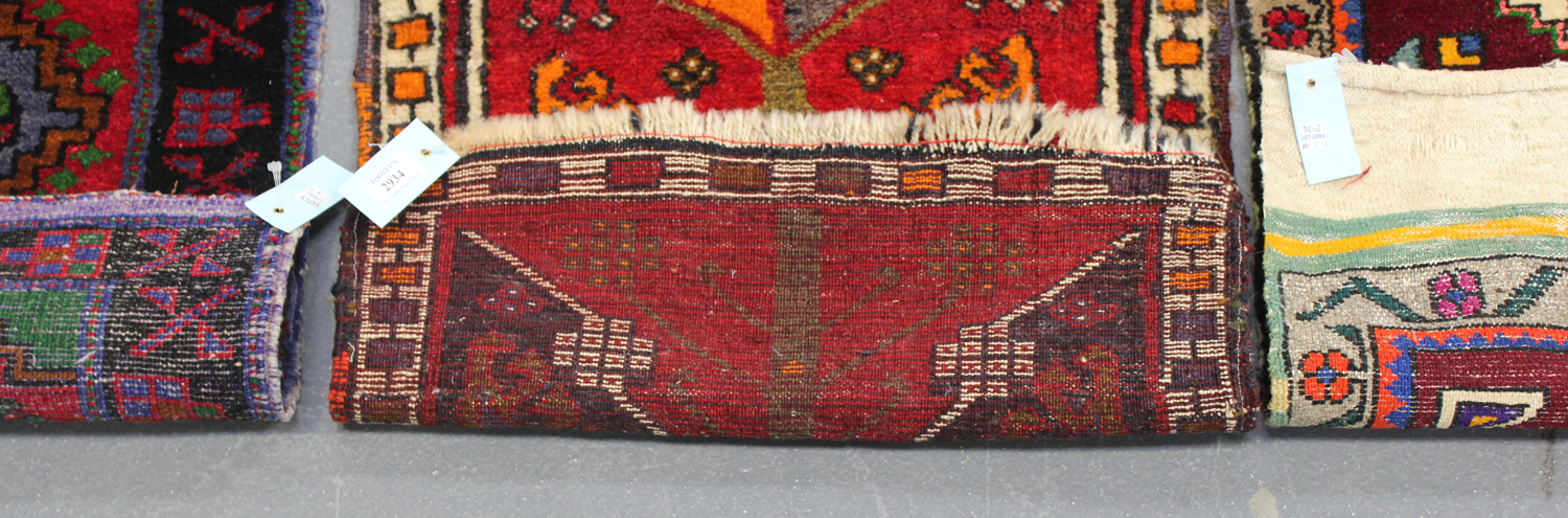 A small Turkish rug, late 20th century, the red field with a pole medallion, within an ivory border, - Image 2 of 2