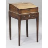 A small 18th century fruitwood estate table, the hinged sloping lid enclosing two drawers, the