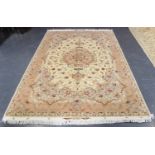A fine Tabriz carpet, Central Persia, modern, the ivory field with a scrolling flowerhead medallion,