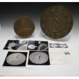 Paul Vincze - a pair of patinated cast bronze medallion prototypes commemorating 'Man's First