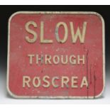 A mid-20th century cast alloy 'Slow Through Roscrea' road sign, 62cm x 69cm.Buyer’s Premium 29.4% (
