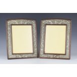 A pair of Chinese hardwood and jade photograph frames, early 20th century, each of slightly arched