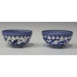 A pair of Japanese Hirado blue and white bowls, Meiji period, of hemi-spherical form, each painted