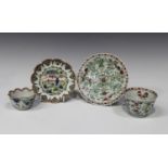 A Chinese famille verte porcelain teabowl and saucer, Kangxi period, each of lobed circular form,