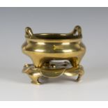 A Chinese polished bronze censer and stand, mark of Xuande but possibly 17th/18th century, the