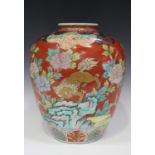 A Japanese Imari porcelain vase, Meiji period, the stout ovoid body painted and gilt with four