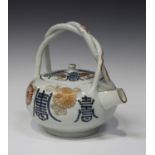 A Japanese Imari porcelain teapot and cover, early 18th century, of compressed globular form,