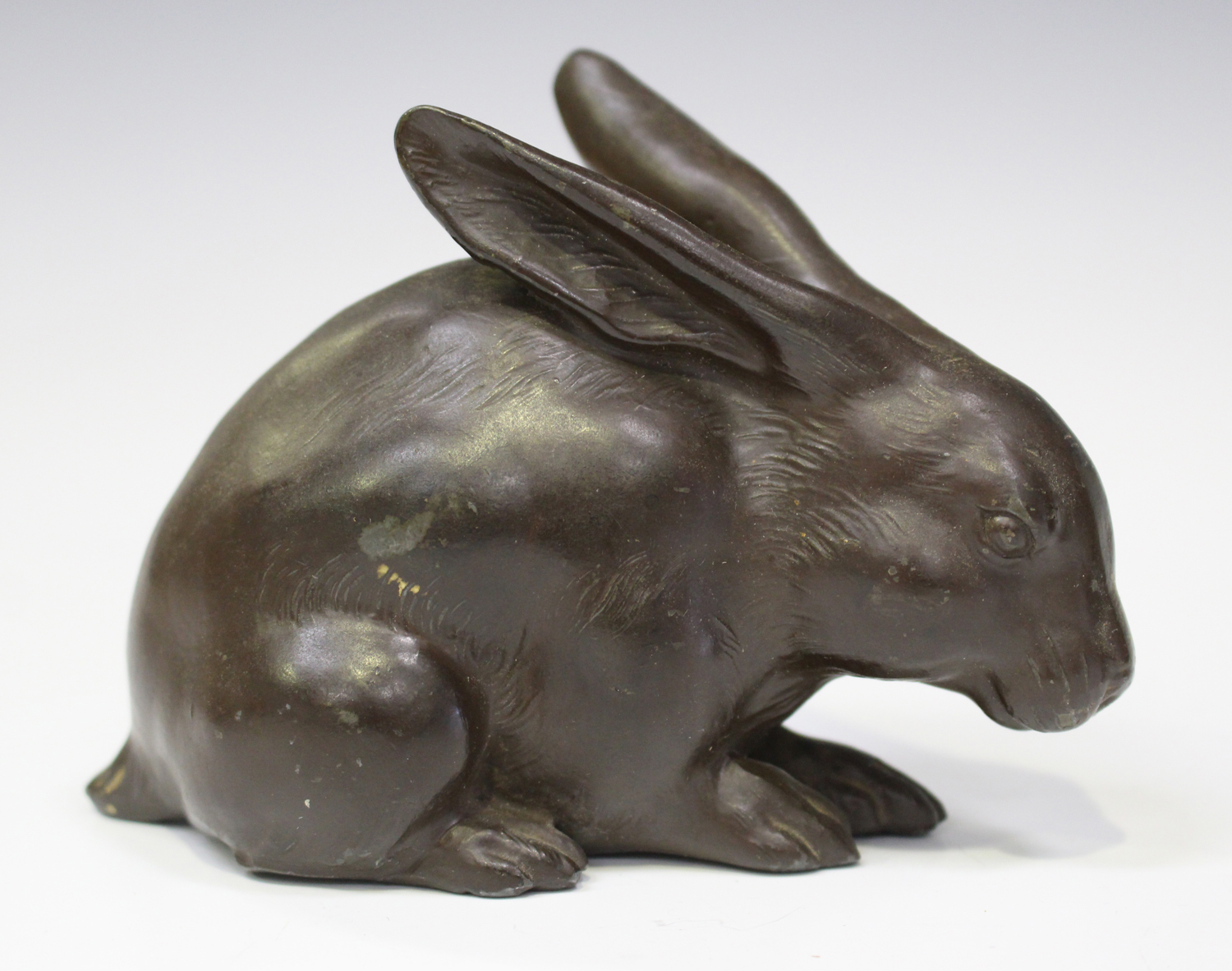 A Japanese brown patinated metal figure of a rabbit, early 20th century, stamped seal mark to - Image 13 of 14