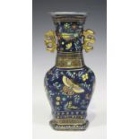 A Chinese blue glazed porcelain vase, late Qing dynasty, of hexagonal baluster form, enamelled