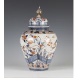 A Japanese Imari porcelain jar and domed cover, late 17th/early 18th century, of shouldered tapering