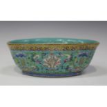 A Chinese famille rose enamelled turquoise ground porcelain bowl, mark of Daoguang and probably of