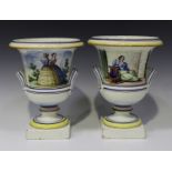 A pair of Continental pottery campana shaped two-handled vases, mid-19th century, the first