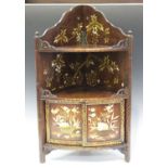 A Japanese inlaid and lacquered wood hanging bowfront corner cabinet, Meiji period, the arched