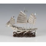 A Chinese silver model of a gunboat by Wang Hing, early 20th century, modelled with three-masted