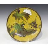 A Japanese cloisonné circular dish, Meiji period, decorated with battling frogs and toads using