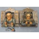 A pair of Austrian terracotta wall plaques, late 19th/early 20th century, modelled as an elderly man