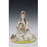 A Japanese Kutani porcelain figure of Kannon, Meiji period, modelled seated wearing a long robe,