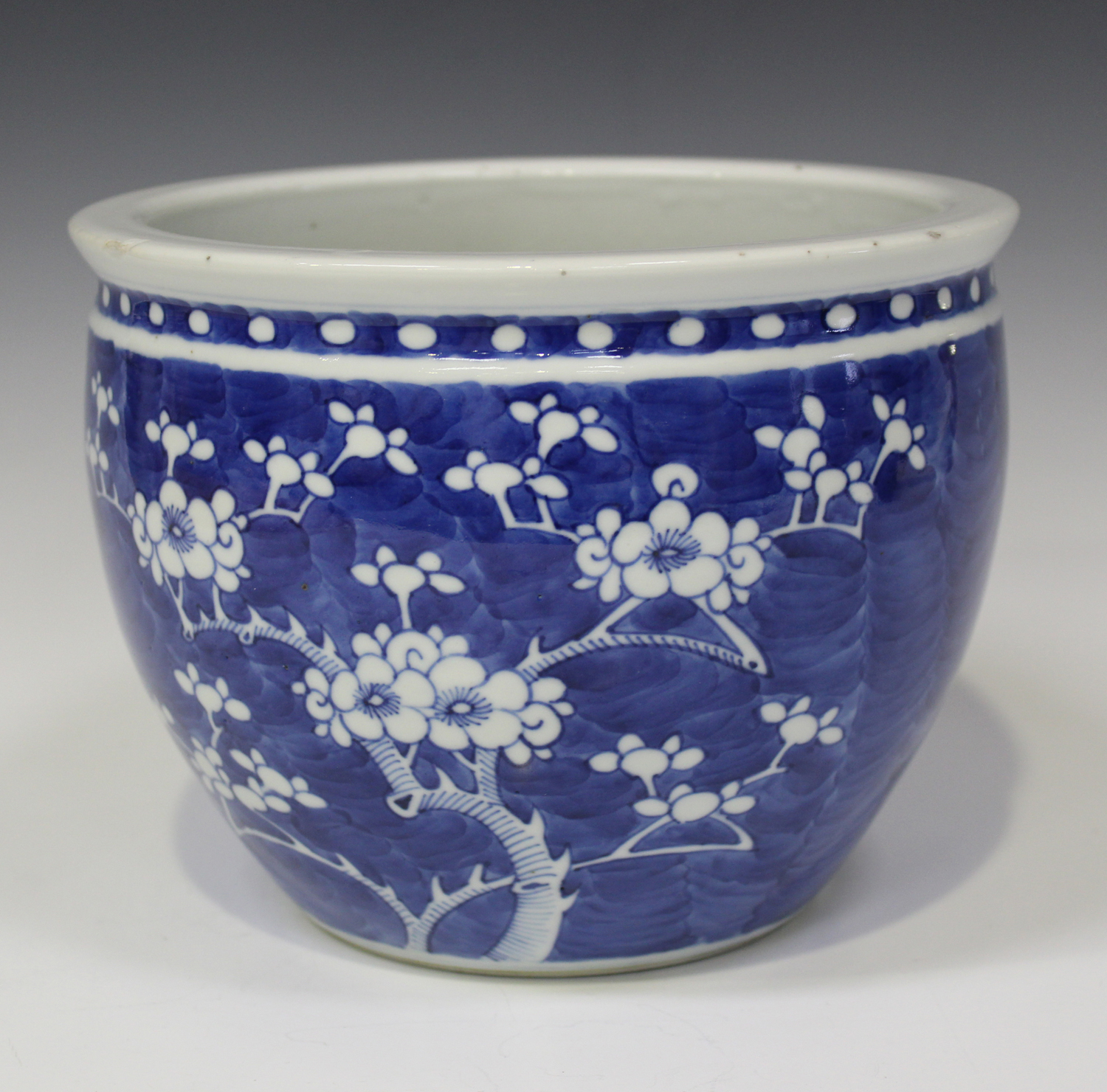 A Chinese blue and white porcelain jardinière, late 19th century, of steep-sided circular form,