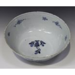 An English Delft circular bowl, probably London, mid-18th century, painted in blue to the exterior