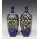 A pair of Japanese cloisonné enamel vases, Meiji period, each hexagonal tapered body decorated