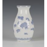 A Japanese Hirado blue and white vase, Meiji period, the ovoid body and flared neck painted with