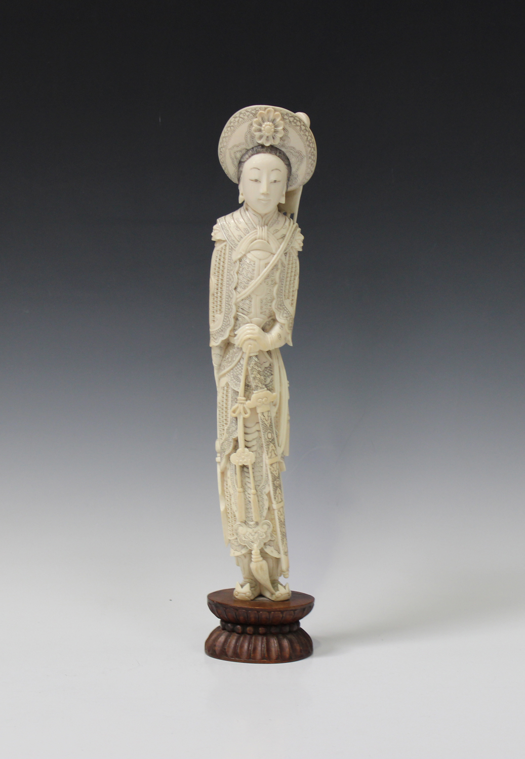 A Japanese carved and stained ivory figure of a female warrior, early 20th century, modelled