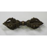 A Tibetan bronze vajra, probably late 19th/early 20th century, each end formed as a crown, centred