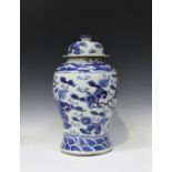 A Chinese blue and white porcelain jar and cover, early 20th century, the baluster body and domed