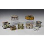 Eight assorted mostly French faience inkwells, late 19th and 20th century, variously shaped and