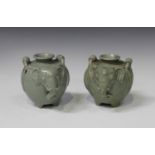 A pair of Thai celadon glazed pottery zoomorphic pots, each of swollen elephant form, height 11.