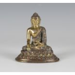 A Sino-Tibetan gilt copper alloy figure of Buddha, Qing dynasty, modelled seated in dhyanasana