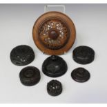 A group of seven Chinese hardwood covers/lids, late 19th/20th century, all with carved and pierced