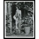 PHOTOGRAPHS. A collection of approximately 79 black and white glamour photographs, some with