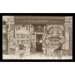 A photographic postcard of R. & E. Cross Newsagents and Confectioners shopfront, published by F.W.